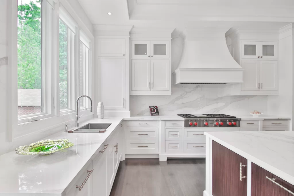 a full height backsplash in Calacatta White Quartz is the focal point for this kitchen